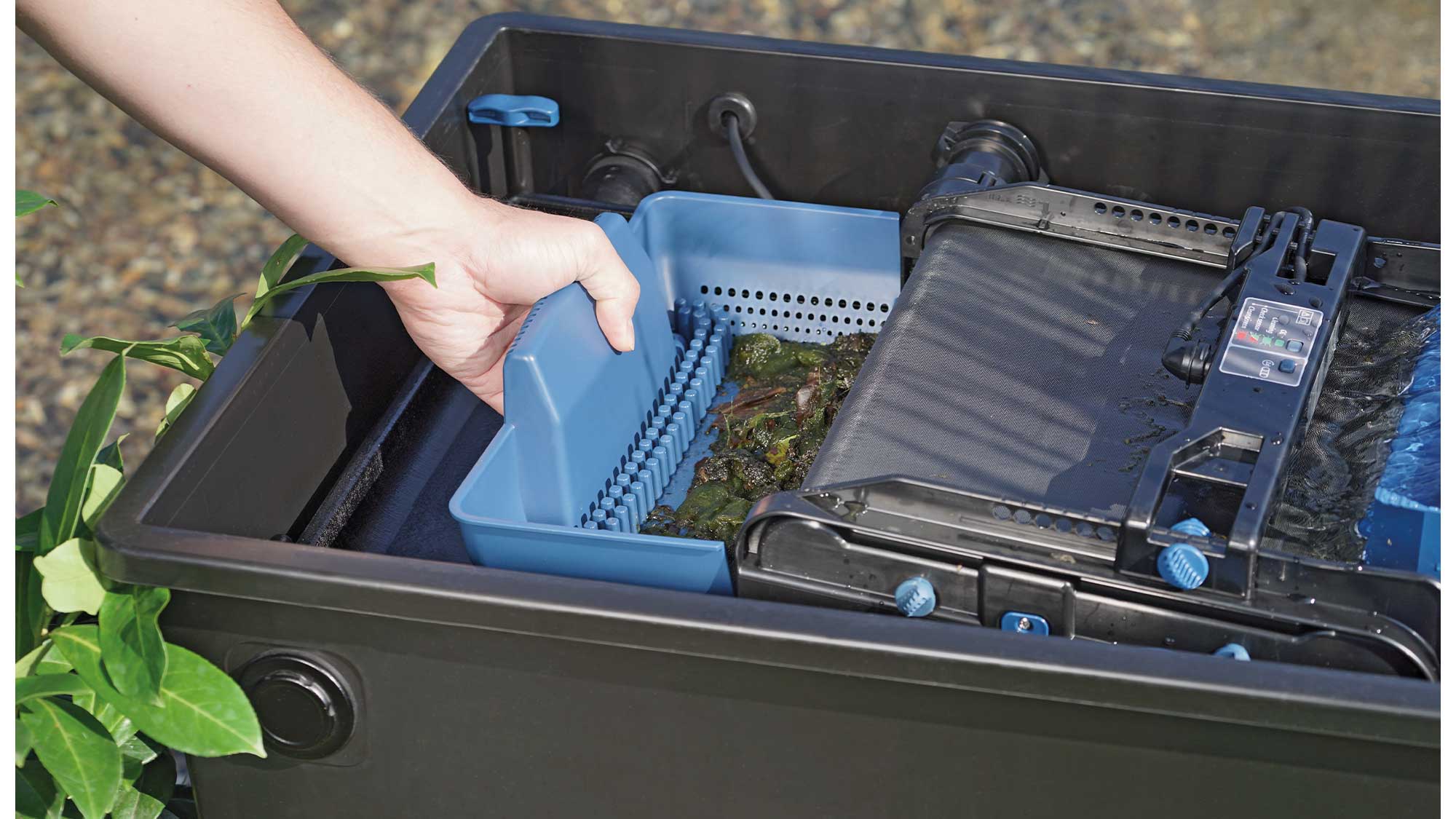 OASE105744-BioTecScreenMatic2 The Oase Biotec ScreenMatic 60000 pond filter combines foam biological media and an automated belt screen to remove solid waste.