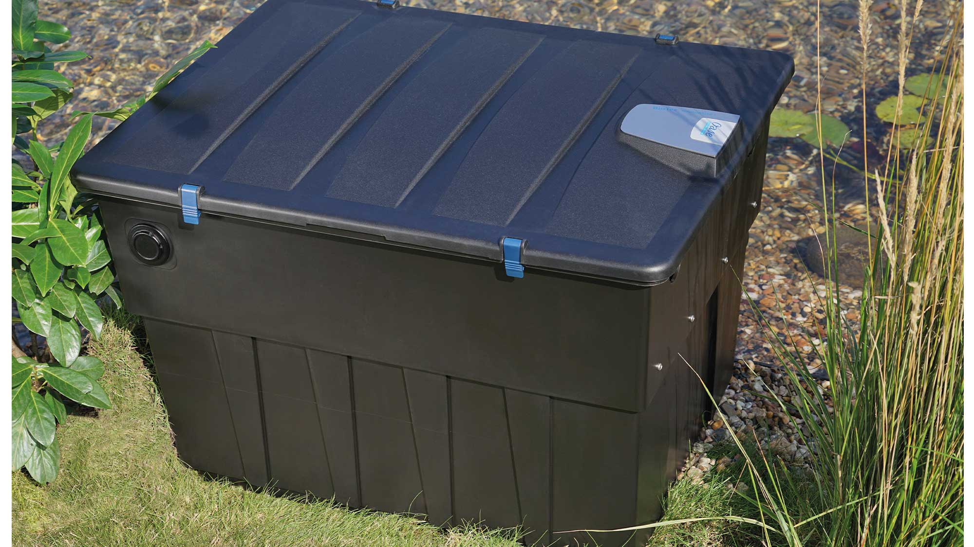 OASE105772-BioTecScreenMatic2 The Oase Biotec ScreenMatic 60000 pond filter combines foam biological media and an automated belt screen to remove solid waste.