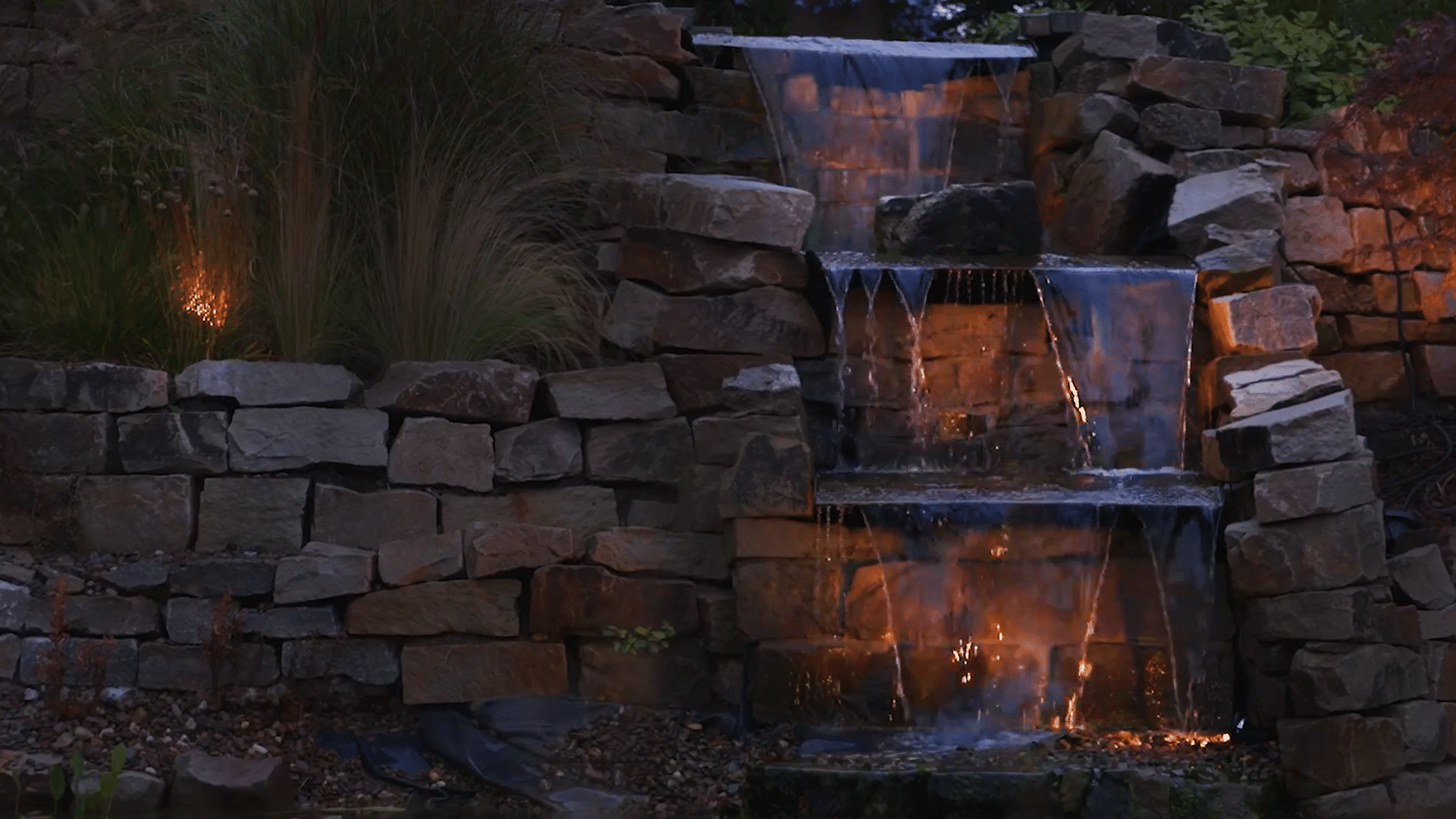 Waterfall lit by LunAqua Connect Multiple lights used to highlight a waterfall and surrounding plants